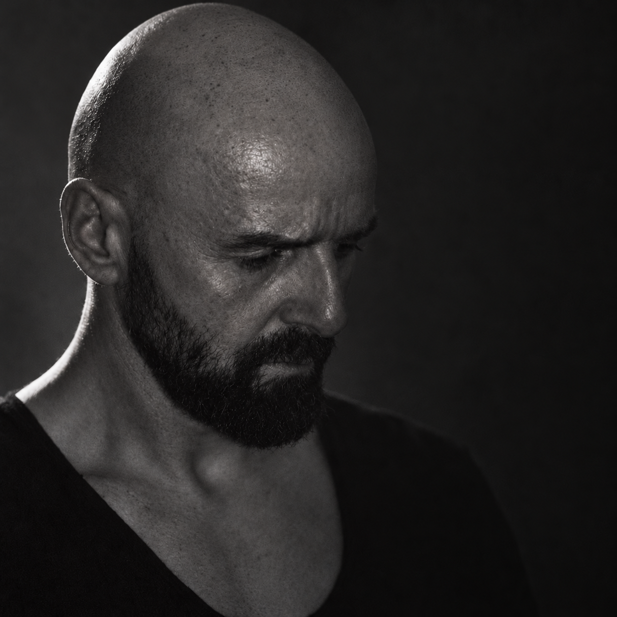 Grainy black-and-white portrait of Adam